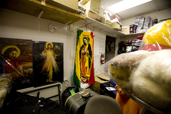 A Virgen of Guadalupe decorates a blanket hung in the back of a dollar store in the Adams Morgan neighborhood in Washington D.C.  Her image, alongside Jesus and Barack Obama, was the most commonly reproduced image in the store.