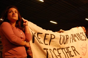 A woman holds a sign at a rally held in downtown Phoenix in opposition to Arizona's new immigration law.